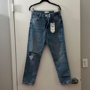 Zara slim fit medium wash blue jeans. Ripped knee detail. Size 6 new with tags